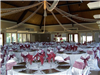 The reception hall is decorated in flowers and streamers for a wedding