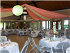 The reception hall is decorated in flowers and streamers for a wedding
