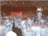 The ballroom is decorated for a wedding reception